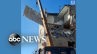 Ukrainian rescue workers respond to damaged residential building in Kharkiv