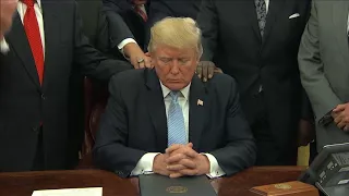 Faith leaders put hands on Trump and pray