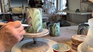 How to paint flowers using underglazes.