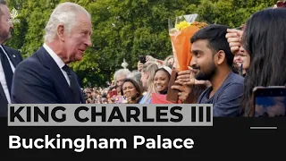 King Charles III greets the public outside Buckingham Palace