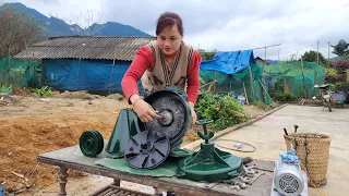 The genius girl repairs and maintains the corn grinding machine