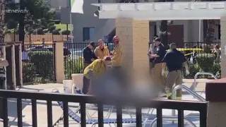 Man, teen, shot dead by apartment pool