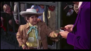 Willy Wonka and the Chocolate Factory but Mike Teavee has a real gun