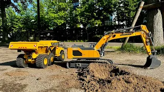1/14th Scale Liebherr 945 Excavator Breaking Soil and Loading the Volvo A40G