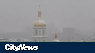 Air raid sirens sound in snow-covered Kyiv