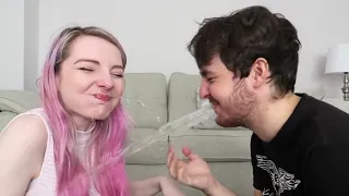 Lizzie and Joel Spits water at each other