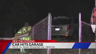 Driver slams into garage in Fenton