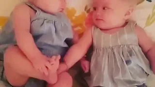 Cutest ever Twins sneeze together and surprise themselves