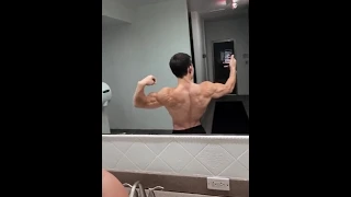 TRISTYN LEE FLEXING BICEPS