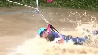 China floods: Child rescued from violent river as flooding continues across country