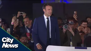 Emmanuel Macron holds on to French presidency