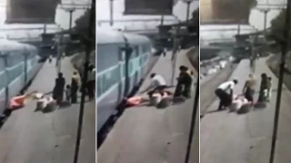 Caught on cam: Woman falls off moving train, saved by people on platform