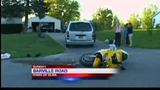 Motorcycle slams into mini van