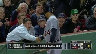 Miggy shakes a fan's hand on his way on deck