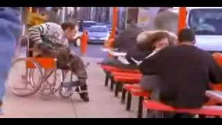 Handicapped man eat a dead pigeon