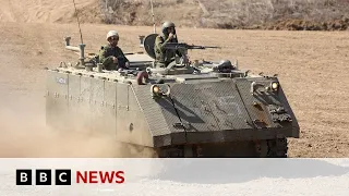 Israel troops taking positions near Gaza border - BBC News