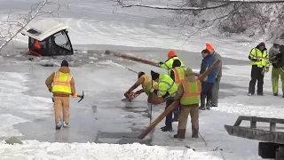 Tractor falls through ice in bitter cold weather