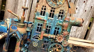 Mixed media, steampunk inspired house: Altered biscuit tin.