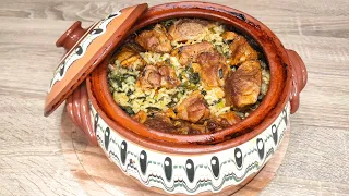 Roast lamb in a casserole with rice and greens