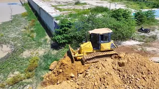 Transaction Filling up land huge, By Bulldozer KOMATSU DR51PX Work With Dump Truck 5 Ton Unloading