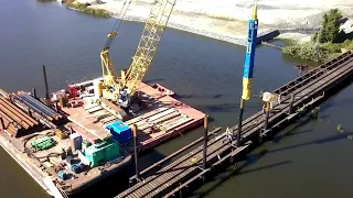 Junttan HHK9s driving piles for railroad bridge