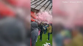 Angry Manchester United fans break into OLd Trafford and storm pitch