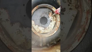 Dustless Blaster removing heavy rust and paint off tractor wheels
