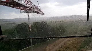 Крановщик во время шторма-грозы на башенном кране.Crane operator during a storm on tower crane!