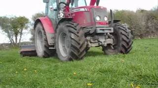 rolling a field with a mf 5470