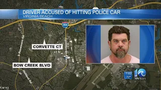 Driver accused of hitting police car