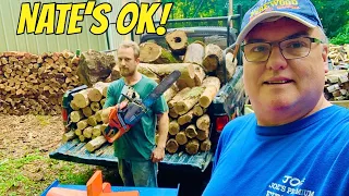 Splitting FIREWOOD rounds out of Ram truck & into trailer