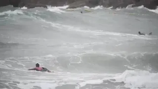 Surfers ride stormy waves in Hong Kong