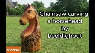 Stihl chainsaw carving a horse head by Beeldighout.nl