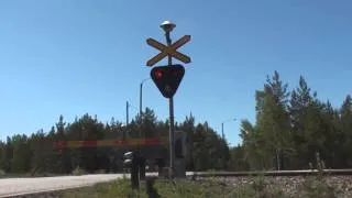 Freight train 3534 passes Krogars level crossing