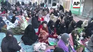 Relatives of victims continue protest by coffins of their loved ones