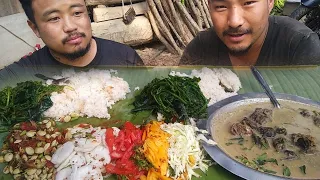 childhood friend and me eating the best naga dish perilla seed with pigeon and stink beans chutney.