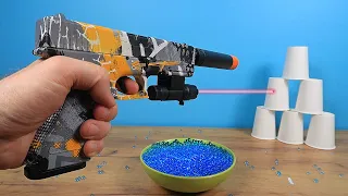 Automatic crystal bullet gun with a laser sight from Aliexpress!