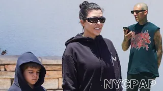 Kourtney Kardashian spotted out running errands while Travis Barker talks on phone outside a studio