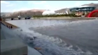 Rising river water sweeps pedestrians off their feet in northwestern China