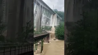 Bridge overflows with water after heavy rainfall in China