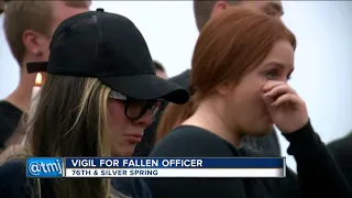 'He didn’t give his life in vain': Vigil for fallen officer draws large crowd