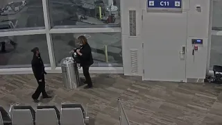 Video shows airline employee stealing items from carry-on bag, trashing the rest