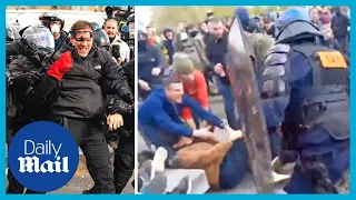Shocking moment Paris riot police kick France pension protesters