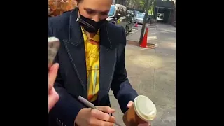 Elizabeth Olsen signing autographs for fans in NYC