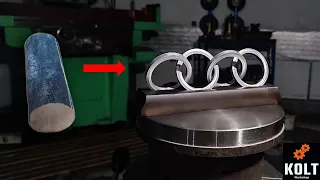 AUDI LOGO. A chain made of a solid piece of metal. Old school manual milling.