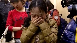 Painful hope lingers for families of MH 370 victims