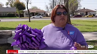 Lining the streets with purple ribbon to honor those affected by cancer