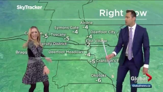 Reporter shows weatherman how to twirl a baton live on-air