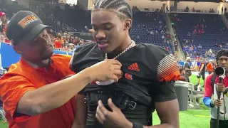 Belleville 2025 QB Bryce Underwood unveils a necklace after winning in 2022 Division 1 State Finals