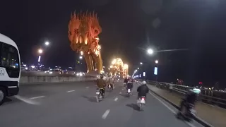 Crossing the Danang Dragon Bridge in Vietnam by Motorcycle